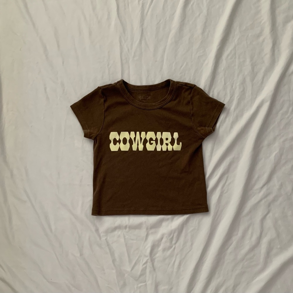A brown cowgirl baby tee